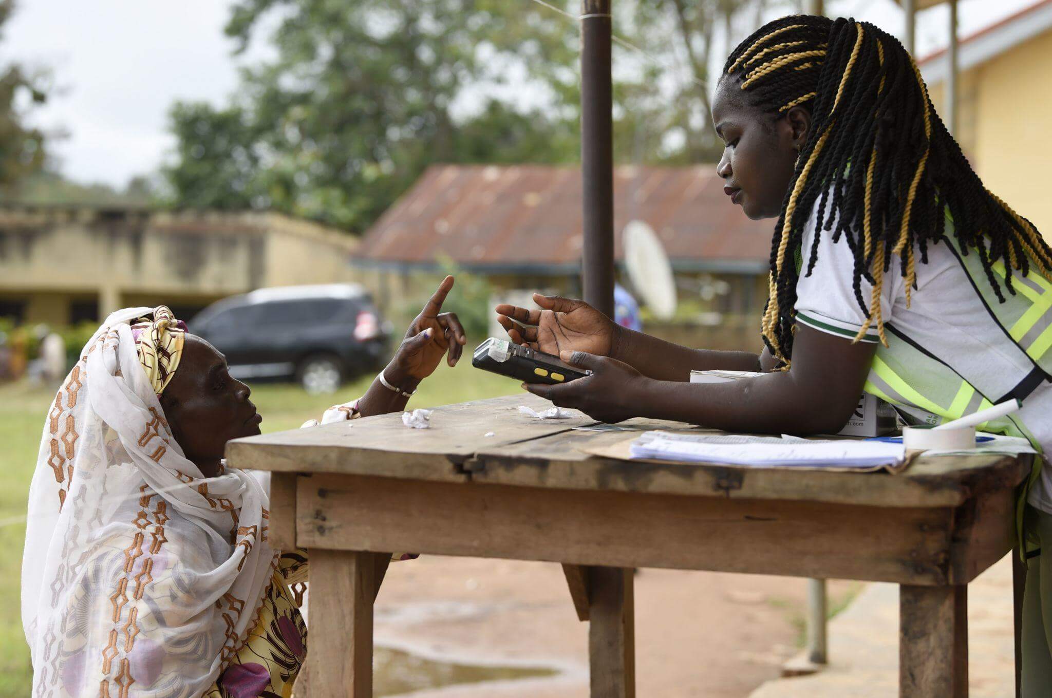 An elderly voter casting her vote