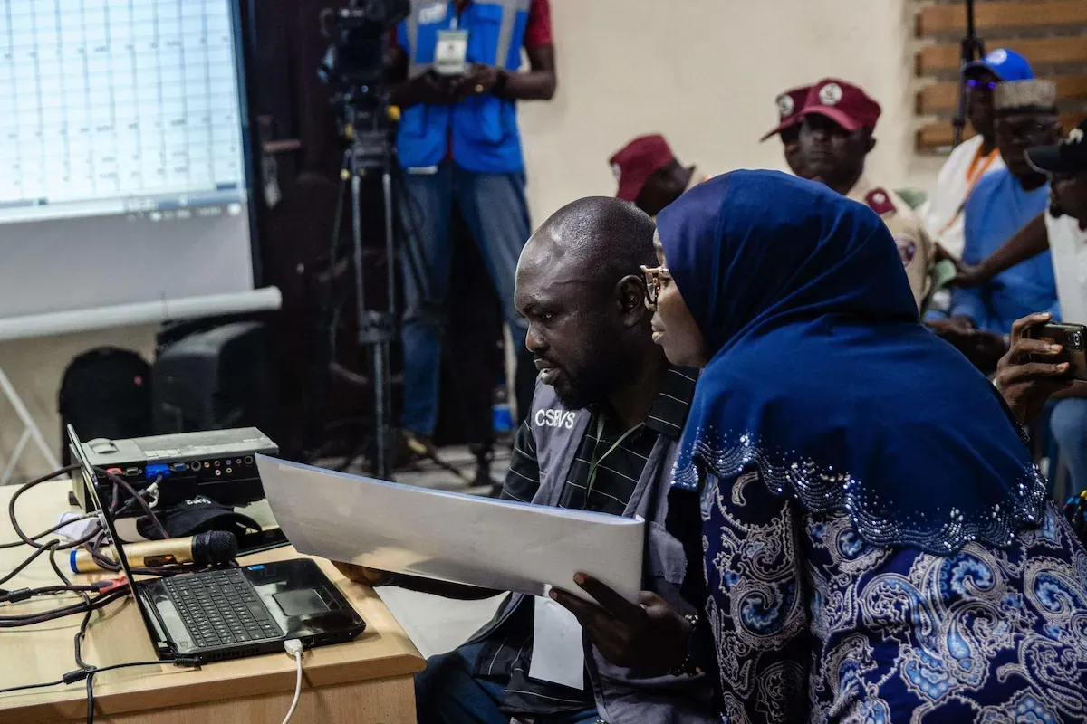 INEC Staff manually reviewing a document