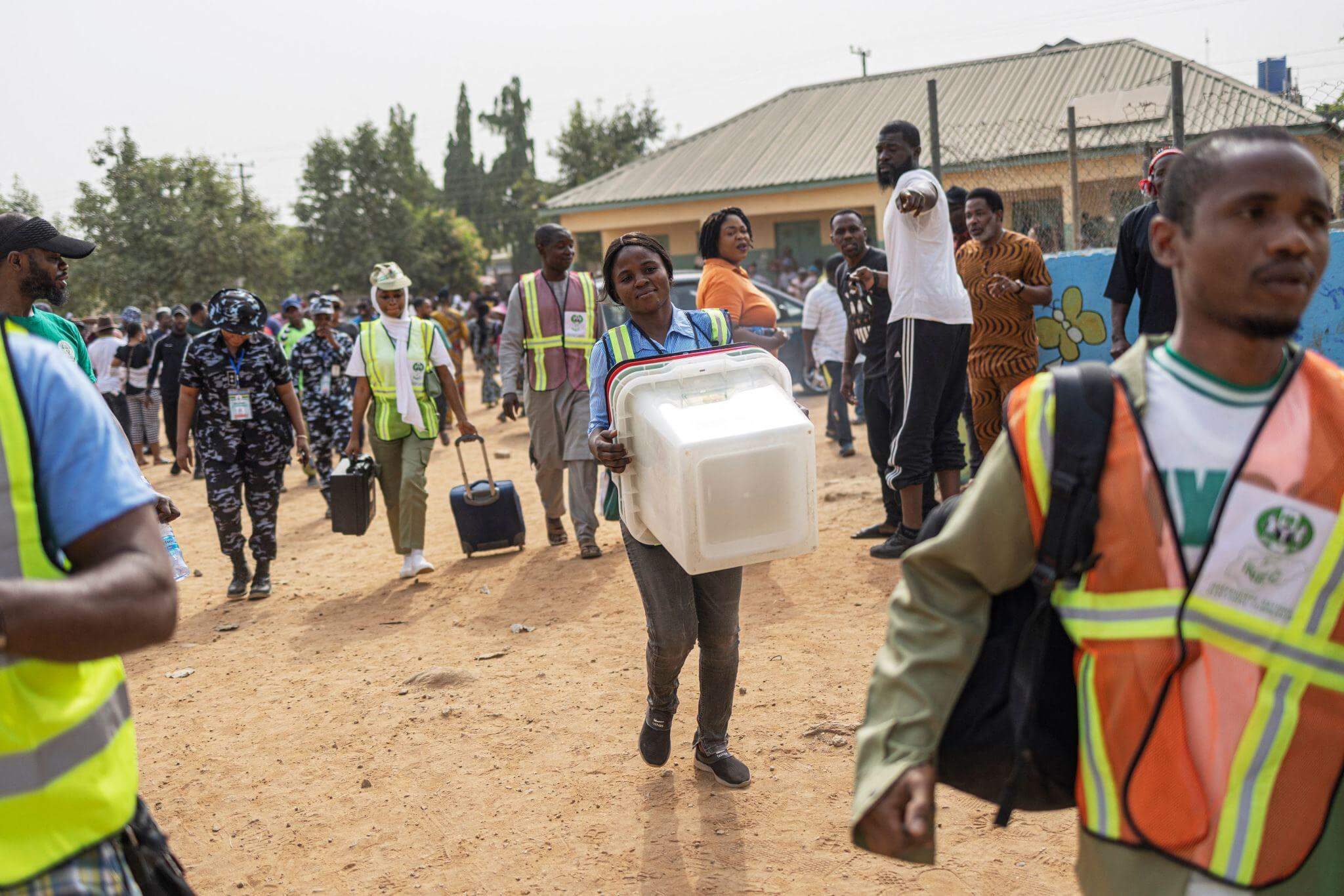 INEC adhoc staff carrying a ballot box