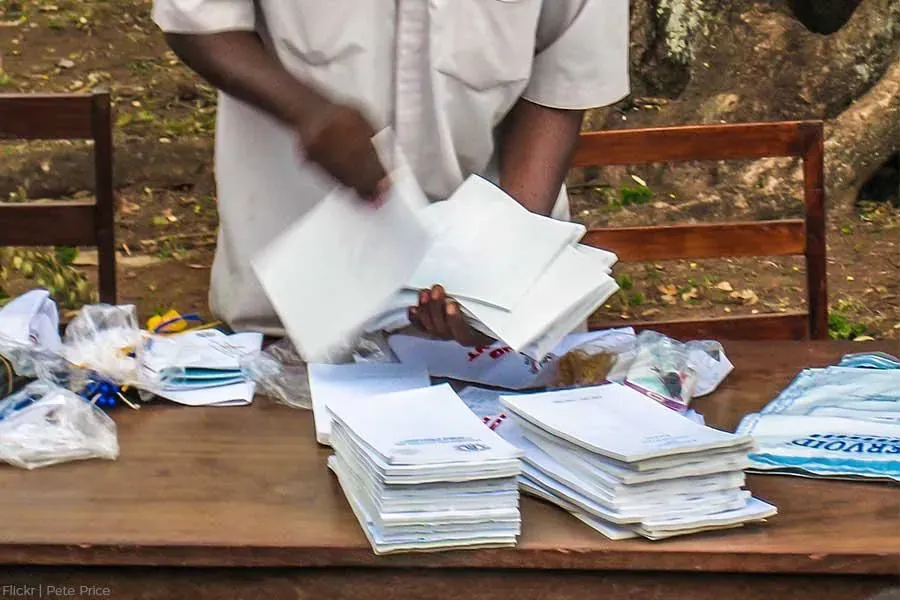 Man counting ballot papers