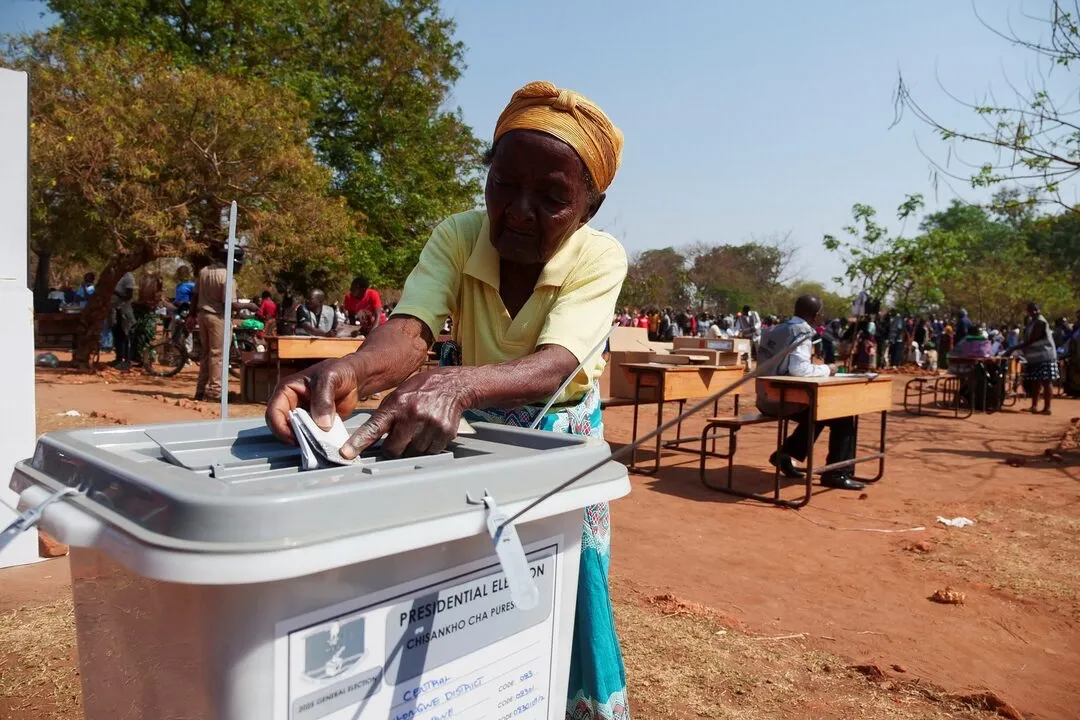 Elderly lady casting her vote