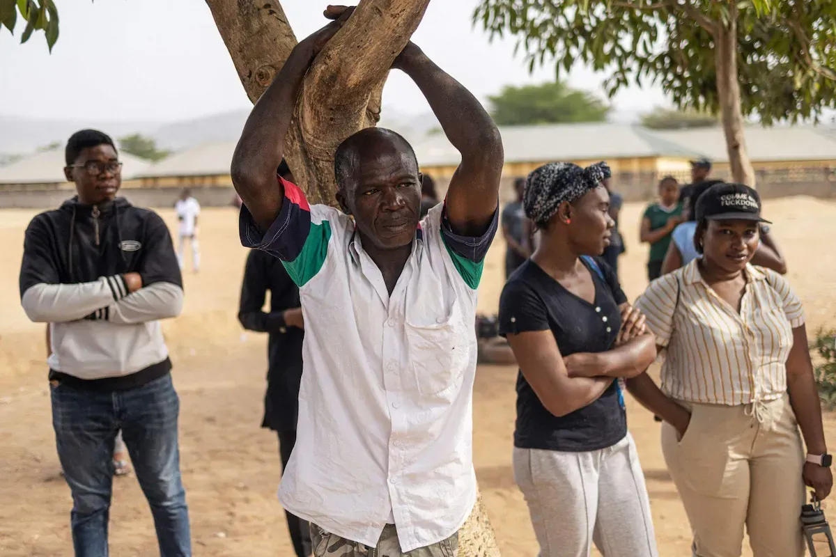 Nigerian voters waiting for election result declaration at a polling unit